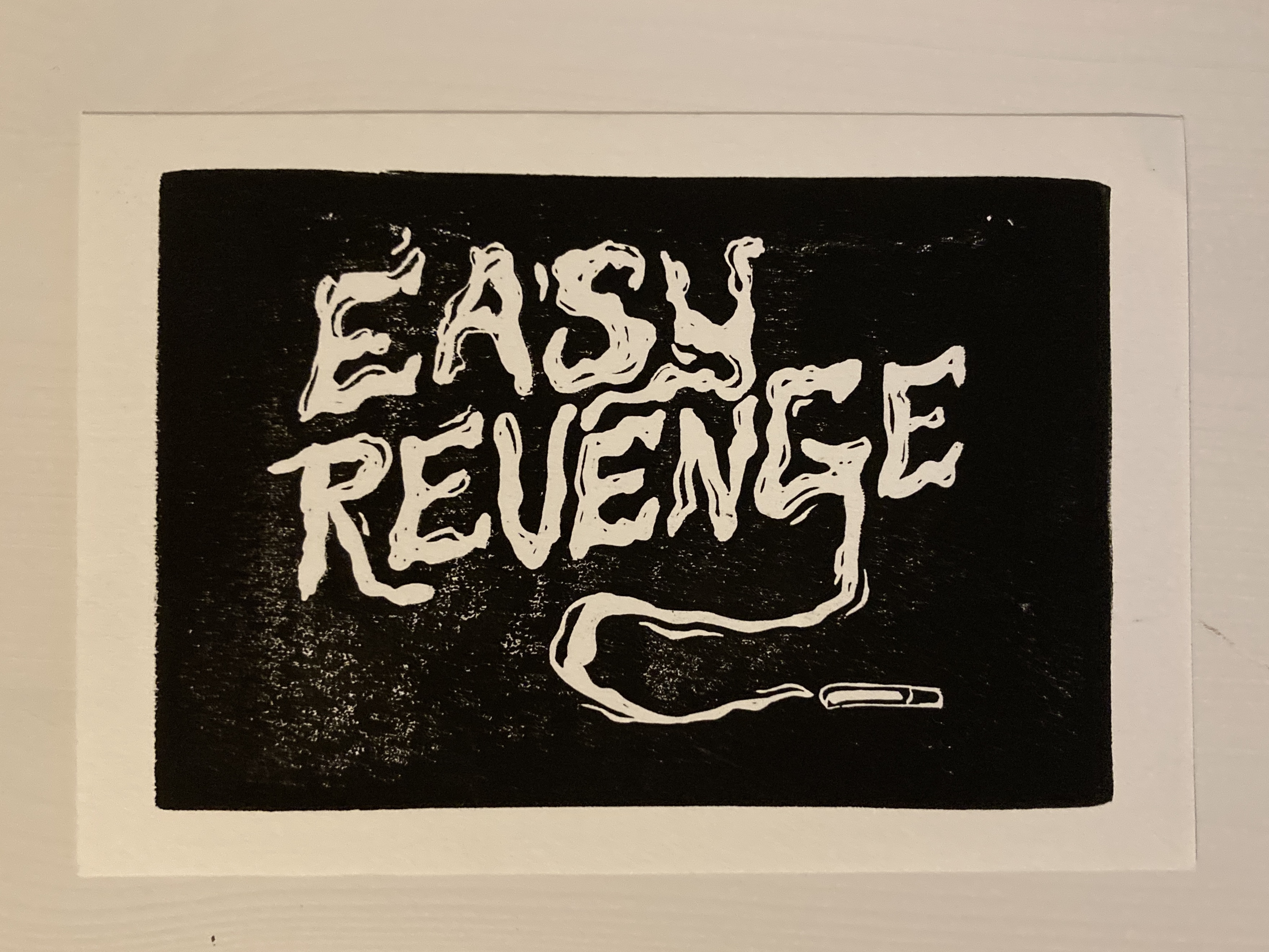 A print saying Easy Revenge